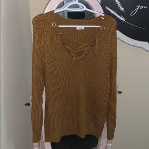 Burnt orange cross-tie sweater.